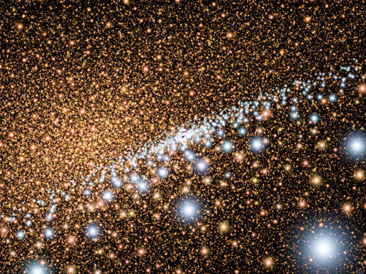 Artist's concept showing a disk of young blue stars encircling a supermassive black hole at the core of the Andromeda Galaxy Artist's concept showing a disk of young blue stars encircling a supermassive black hole at the core of the Andromeda Galaxy