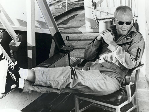 Astronaut John Glenn rests aboard the USS Noa after his historic Gemini flight.