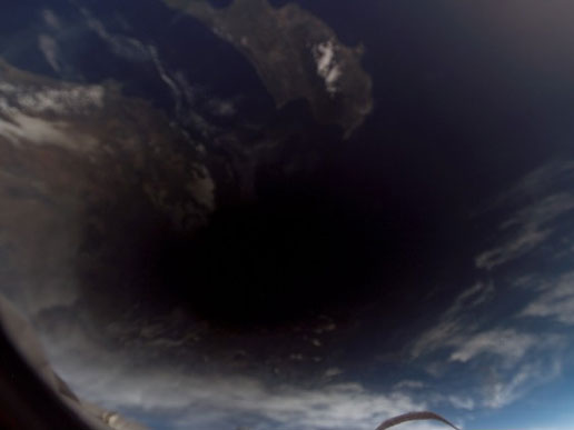 The shadow of the moon falls on Earth.