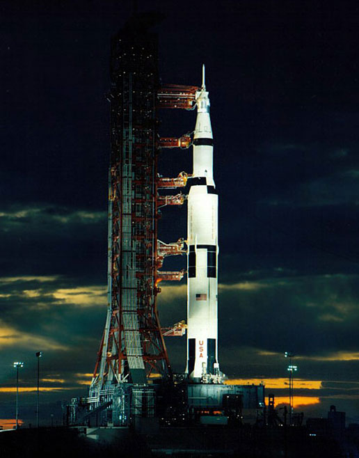 As spotlights play on the rocket and launch pad at dusk, the last moon shot, Apollo 17, is pictured here awaiting its December 1972 night launch. As spotlights play on the rocket and launch pad at dusk, the last moon shot, Apollo 17, is pictured here awaiting its December 1972 night launch.