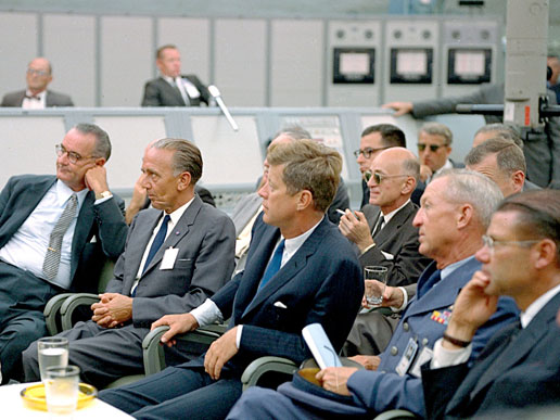 President John F. Kennedy attends a briefing at the Cape Canaveral Missile Test Annex with Vice-President Lyndon Johnson, Secretary of Defense Robert McNamara and other staff.